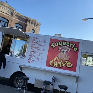 a man standing in front of a food truck