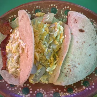 Bacon and egg, potato and egg and chorizo and egg breakfast tacos