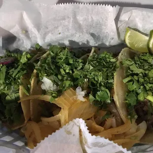 two tacos and a lime wedge