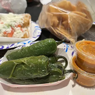 Complimentary jalapeños salsa and chips to go.