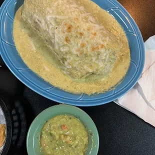 Alambre burrito smothered in green sauce! Guacamole salsa on side!