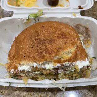 a sandwich in a styrofoam container
