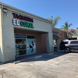 a car parked in front of the store