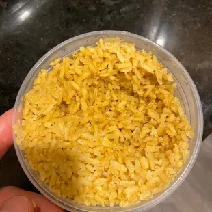Salty rice with too much powdered flavoring.