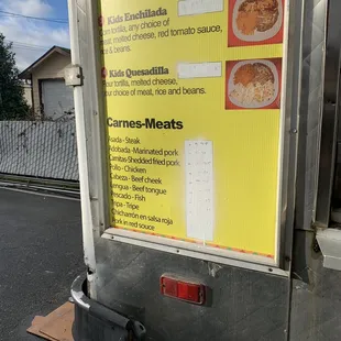 a menu on a food truck