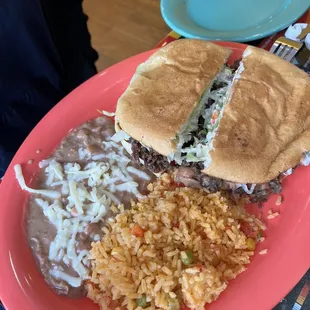 Torta de carne asada (steak) dinner. Torta even had avocado. Includes rice and beans.