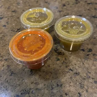 Green and red taco sauce.