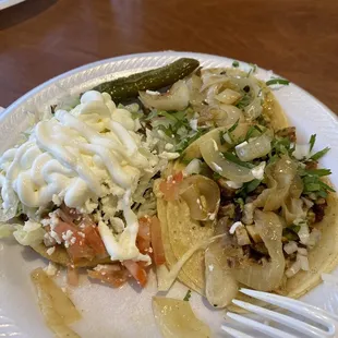 Sope and two chicken tacos