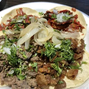 Pastor tacos, asada on the left and tripa on the right