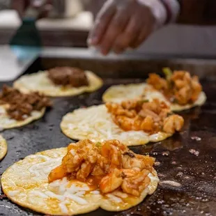 a person making tacos