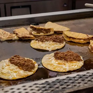 tortillas cooking on a grill