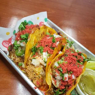 three tacos on a tray