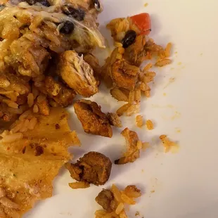 Picture of the inside of the Grilled Chicken Super Burrito. Very dry and hard and over cooked chicken.