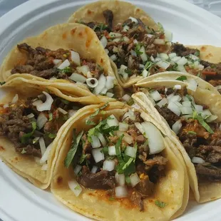 Six carne asada tacos with diced onions and cilantro (3/27/21)