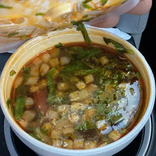 a person holding a plate of food