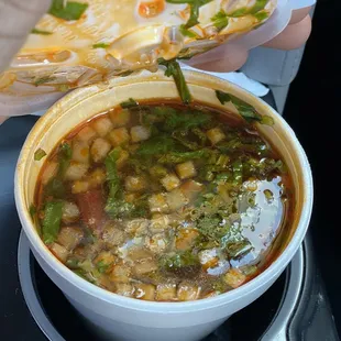 a person holding a plate of food