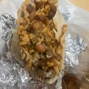 Super burrito everything on it, with extra sour cream but looks like a bean and rice burrito ... smh