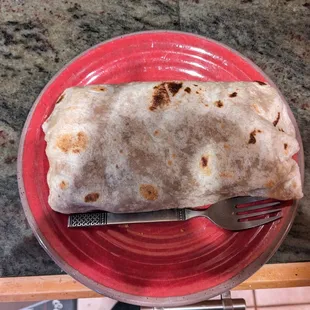 Super burrito with fork for size comparison