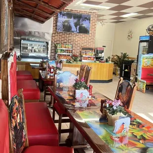 a long table with red chairs