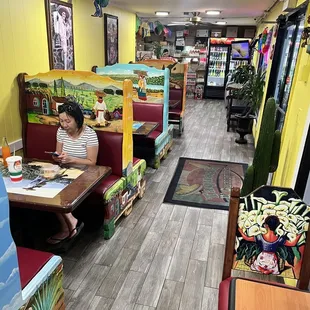 4 top seats with carved relief mural booths