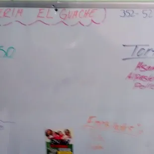 a white board with spanish writing