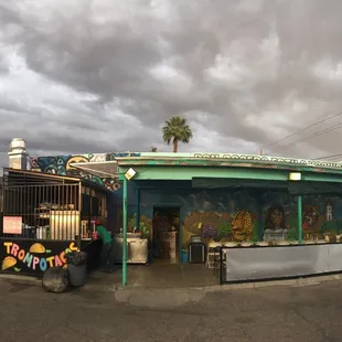 a taqueria on the corner of a street