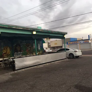 a car parked in front of a taqueria