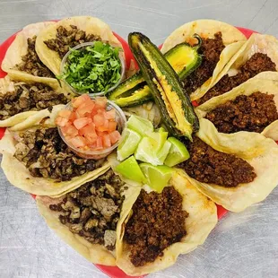 a heart shaped plate of tacos