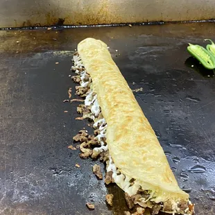 a taqueria roll on a grill