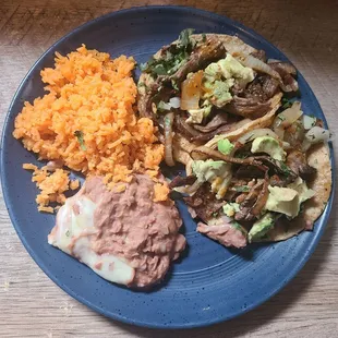 Taco Dinner Plated (Steak Asada with Onions) I added avocados from home.