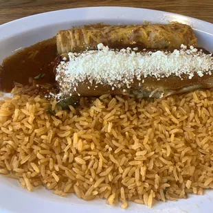 Enchilada and tamale combo with double rice no beans