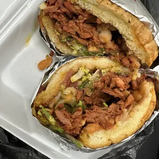 a sandwich in a styrofoam container