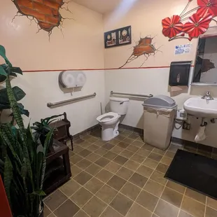 a bathroom with a toilet and sink