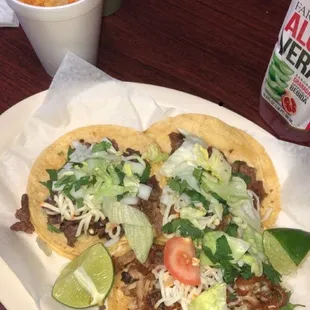 Chicken taco, asada taco, and tripe taco with a side of rice