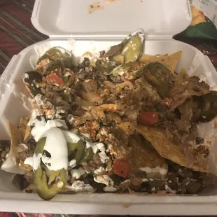 I order a 2 super nachos and I Received 2 regular nachos There&apos;s no gacamole,no pico de gallo look like the work is very sloppy