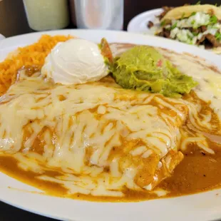 Ah burrito platter with beans and rice in the side.  Yummy!