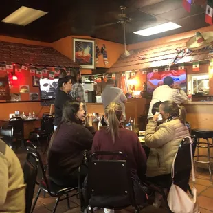 a group of people sitting at a table