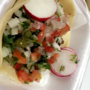 Homemade soft shell taco with all of the accouterments from their hot sauce etc bar!