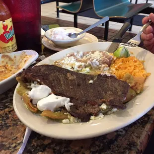 Chilaquiles with steak and green salsa