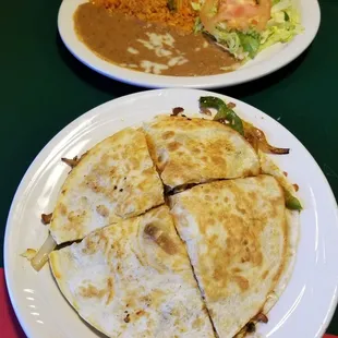 Fajita Quesadilla with Mexican Rice, Refried Beans and Sour Cream Salad.