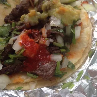 a taco with meat and vegetables