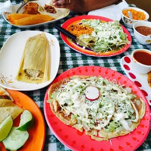 al pastor tacos. tamales. sope. enchiladas. beans and rice. pupusa. read my review.