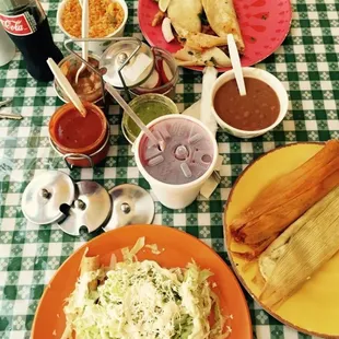 2nd visit--red and green tamales in corn husk. flautas (i call them rolled tacos).  jamaica and a coke. al pastor tacos. beans n rice.