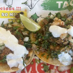 Al Pastor and chicken tacos. Add sour cream.