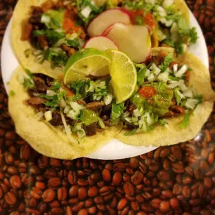 a plate of tacos and beans