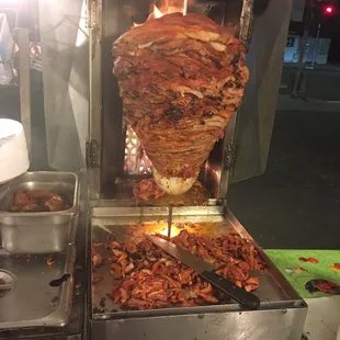 meat being cooked on a spiter