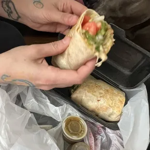 a dog eating a burrito