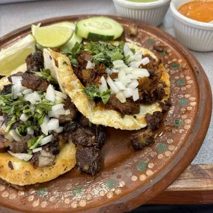 Behold one lamb taco and one cabeza taco, served with choice of sauce for each. Generous portions of quality meat!