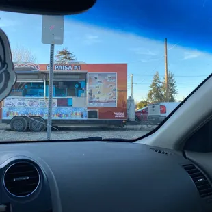 a taqueria in the background