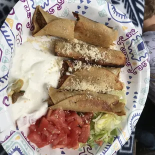 5 chicken flautas, crema, lettuce and tomato on the side